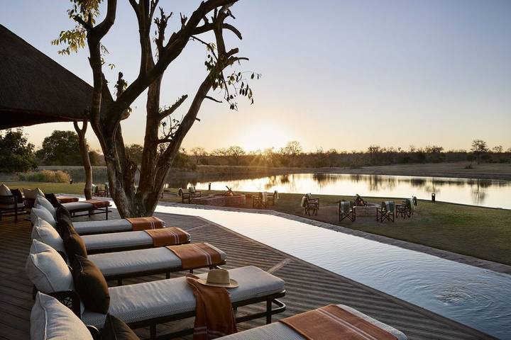 Pool deck at sunset, Arathusa Safari Lodge